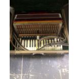 A PIANO ACCORDIAN.