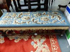AN OAK DOUBLE FOOTSTOOL WITH BLUE GROUND FLORAL NEEDLE WORK SEAT