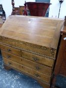 A 19th C. OAK BUREAU, THE FALL ABOVE TWO SHORT AND TWO LONG DRAWERS ON BRACKET FEET. W 92 x D 49 x H