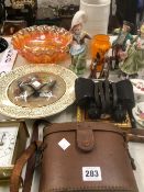 THREE FIGURINES, A PAIR OR WRAY BINOCULARS, ETC.