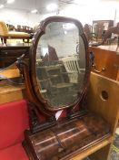 A VICTORIAN MAHOGANY DRESSING TABLE MIRROR, THE QUATREFOIL PLATE BETWEEN FOLIATE ARMS RESTING ON A