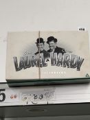 A SET OF LAUREL AND HARDY DVDS.