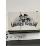 A SET OF LAUREL AND HARDY DVDS.