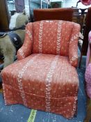 A VICTORIAN NURSING CHAIR ON TURNED MAHOGANY FRONT LEGS