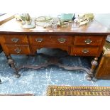 A 19th C. CROSS BANDED MAHOGANY SIDE TABLE, THE RECTANGULAR TOP ABOVE FIVE DRAWERS, THE TURNED