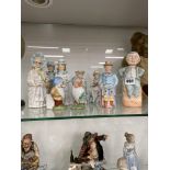 A SMALL COLLECTION OF ANTIQUE PORCELAIN NODDING FIGURINES.