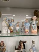A SMALL COLLECTION OF ANTIQUE PORCELAIN NODDING FIGURINES.