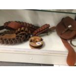 FOUR CARTRIDGE BELTS, A STAR BACK FISHING REEL AND A WILLIAM POWELL CARTRIDGE BAG BY BRADY