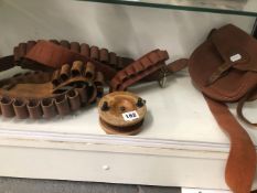 FOUR CARTRIDGE BELTS, A STAR BACK FISHING REEL AND A WILLIAM POWELL CARTRIDGE BAG BY BRADY