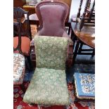 A VICTORIAN MAHOGANY SHOW FRAME ARMCHAIR TOGETHER WITH A NURSING CHAIR, THE RECTANGULAR BACK AND