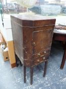 A GEORGE III MAHOGANY BEDSIDE CUPBOARD, THE LID OPENING ONTO WASH BOWL AND JUG RECEIVERS ABOVE TWO