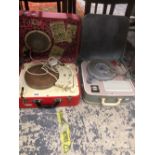THREE RETRO RECORD PLAYERS IN CARRY CASES AND A RECORD CASE.