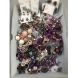 A QUANTITY OF MODERN COSTUME JEWELLERY PREDOMINATELY PINK AND PURPLE TONES