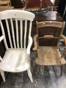 AN OXFORD ELBOW CHAIR STAMPED JN TOGETHER WITH A WHITE PAINTED KITCHEN ELBOW CHAIR WITH BROAD CURVED