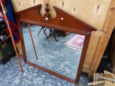 A 20th C. RECTANGULAR MIRROR IN A MAHOGANY FRAME WITH THE BROKEN PEDIMENT CENTRED BY A BALUSTER