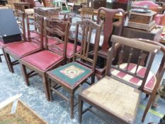 A SET OF SIX MAHOGANY DINING CHAIRS WITH PIERCED LADDER BACKS AND RED DROP IN SEATS TOGETHER WITH