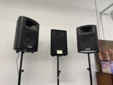 A PAIR OF PRO SOUND NO8CQ SPEAKERS ON ADJUSTABLE STANDS AND ONE OTHER.