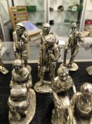 A COLLECTION OF SILVERPLATED CAST METAL FIGURES