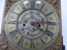 A 19th C. CARVED OAK LONG CASED CLOCK WITH ARCHED BRASS DIAL. H 113cms.