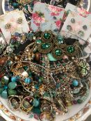 A QUANTITY OF MODERN COSTUME JEWELLERY PREDOMINATELY GREEN AND BLUE TONES.