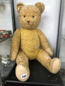 A LARGE VINTAGE JOINTED TEDDY BEAR.