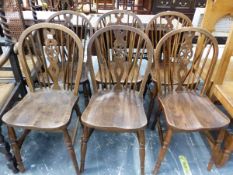 A SET OF SIX WHEEL BACK CHAIRS TOGETHER WITH TWO ELBOW CHAIRS WITH CANED BACKS AND RUSH SEATS
