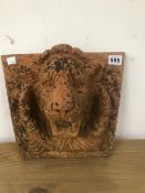 A TERRACOTTA LION MASK PLAQUE.