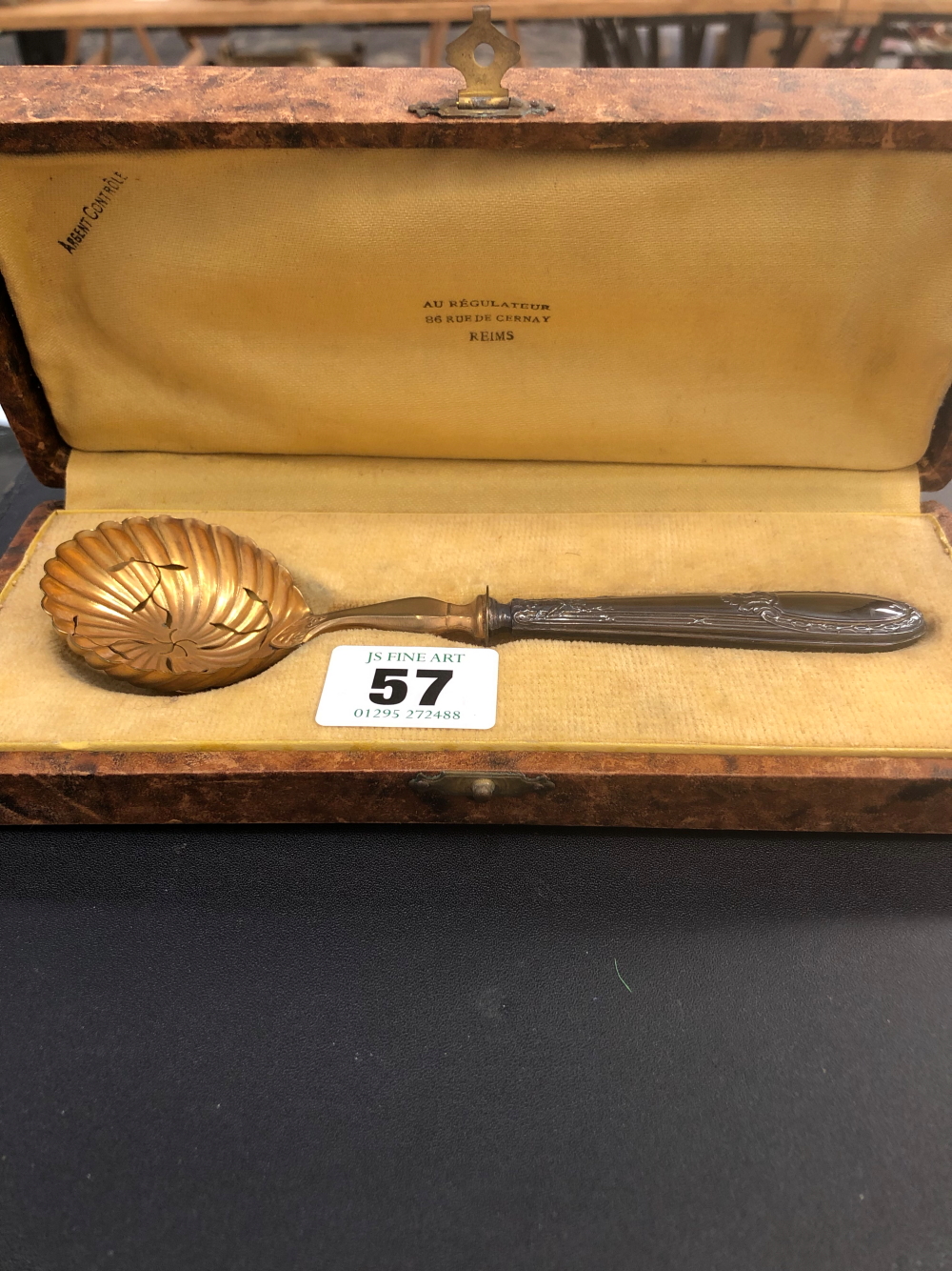 A CASED SILVER GILT CONTINENTAL SIFTER SPOON.