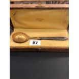 A CASED SILVER GILT CONTINENTAL SIFTER SPOON.