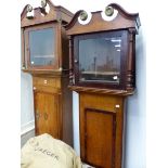 TWO MAHOGANY CROSS BANDED OAK LONG CASE CLOCK CASES, BOTH WITH SWAN NECK PEDIMENTS MOUNTED WITH