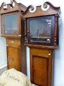 TWO MAHOGANY CROSS BANDED OAK LONG CASE CLOCK CASES, BOTH WITH SWAN NECK PEDIMENTS MOUNTED WITH