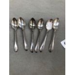 A SET OF SIX HALLMARKED SILVER TEASPOONS.