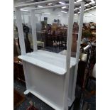 A PAIR OF WHITE PAINTED DISPLAY SHELVES, DOUBLE SIDED AND WITH CENTRAL GLASS PANELS. W 100 x D 30