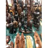 A COLLECTION OF CARVED ETHNIC BUSTS AND FIGURES.