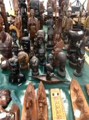 A COLLECTION OF CARVED ETHNIC BUSTS AND FIGURES.