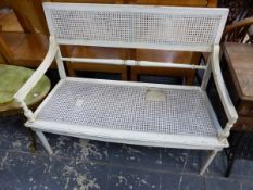 A WHITE PAINTED AND CANED TWO SEAT BENCH