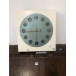 A ZODIAC SIGN MOUNTED CLOCK FACE.