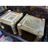 A PAIR OF ETHNIC STOOLS WITH CUT FUR SEATS INSCRIBED MUNA AND LUUL
