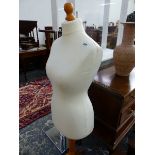 A LADYS MANNEQUIN RAISED ON A PINE TRIPOD. H 146cms.