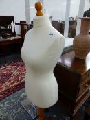 A LADYS MANNEQUIN RAISED ON A PINE TRIPOD. H 146cms.