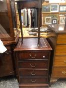 AN ANTIQUE MAHOGANY TRIANGULAR TOPPED WINE TABLE ON THREE CYLINDRICAL LEGS TAPERING TO PAD FEET.