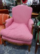 AN ARMCHAIR UPHOLSTERED IN PINK GROUND MATERIAL, TRACES OF GILDING TO THE ANTHEMION CARVED ON THE