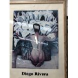 A FRAMED COLOUR PRINT OF A SEATED FIGURE AFTER DIEGO RIVERA 94 x 69cms