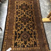 A TRIBAL BELOUCH RUG. 182 x 107cms