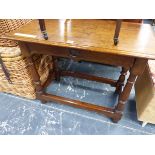 AN ANTIQUE OAK TABLE WITH SINGLE DRAWER ABOVE THE BALUSTER TURNED LEGS JOINED BY STRETCHERS ABOVE TH