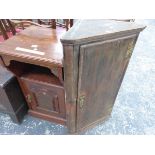 A LATE VICTORIAN MAHOGANY BEDSIDE CUPBOARD WITH AN OPEN SHELF ABOVE THE CARVED DOOR. W 42 x D 40 x H