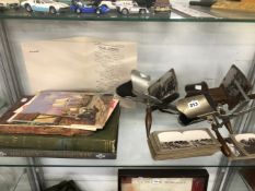 THREE STEREOSCOPIC VIEWERS AND A QUANTITY OF SLIDES INCLUDING FIRST WORLD WAR IMAGES AND CUNARD