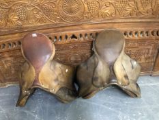 TWO LEATHER SADDLES.