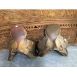 TWO LEATHER SADDLES.