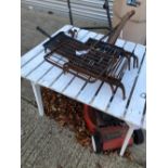 PAINTED GARDEN TABLE AND A QUANTITY OF GRIDDLES